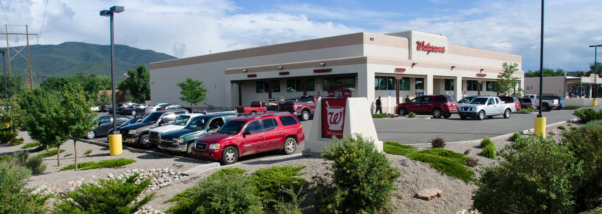 Commercial site development with mountain backdrop — AEI Engineering project